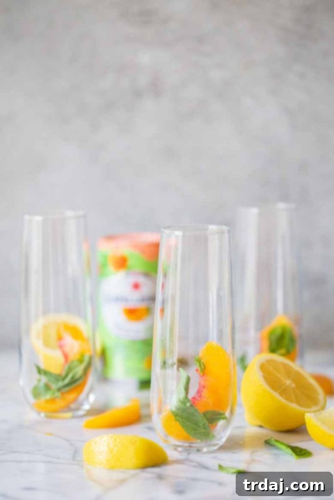 Preparing Peach Basil Mojito Mocktail: Peaches and basil in glass