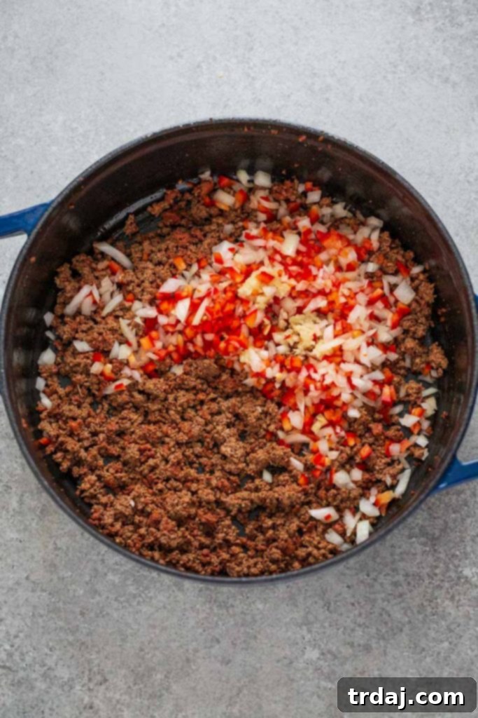 Beef and chorizo cooked with red bell pepper, onion and garlic for baked beef empanadas