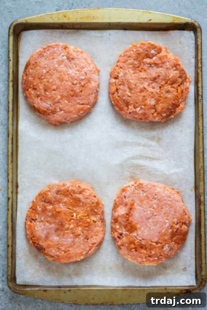 Uncooked Chile Chorizo Burgers, perfectly formed and ready for the grill