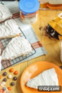 A delicious Pumpkin Spice Latte Scone, richly glazed with cinnamon cream cheese frosting and studded with M&M's, a perfect treat for autumn mornings. Easy recipe using cake mix.
