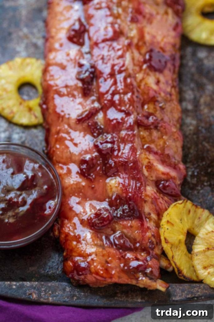 Admire the delicious Cherry Pineapple Glazed Ribs, cooked to perfection with sweet, irresistible flavors. Cherry Pineapple Glazed Ribs