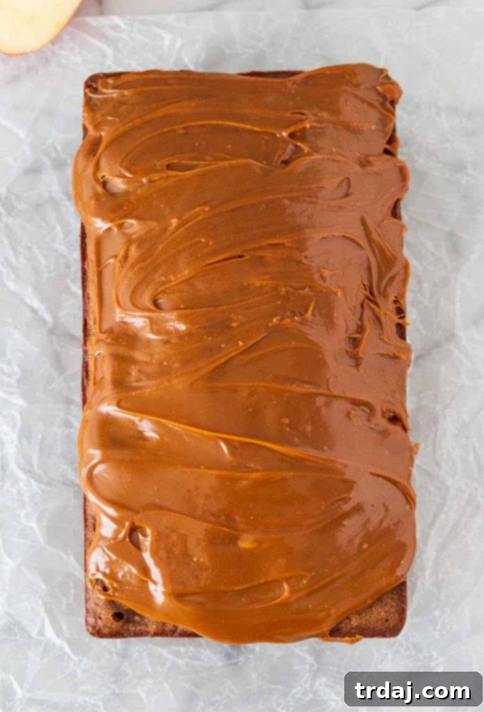 Caramel Apple Cider Banana Bread with a thick layer of caramel sauce.