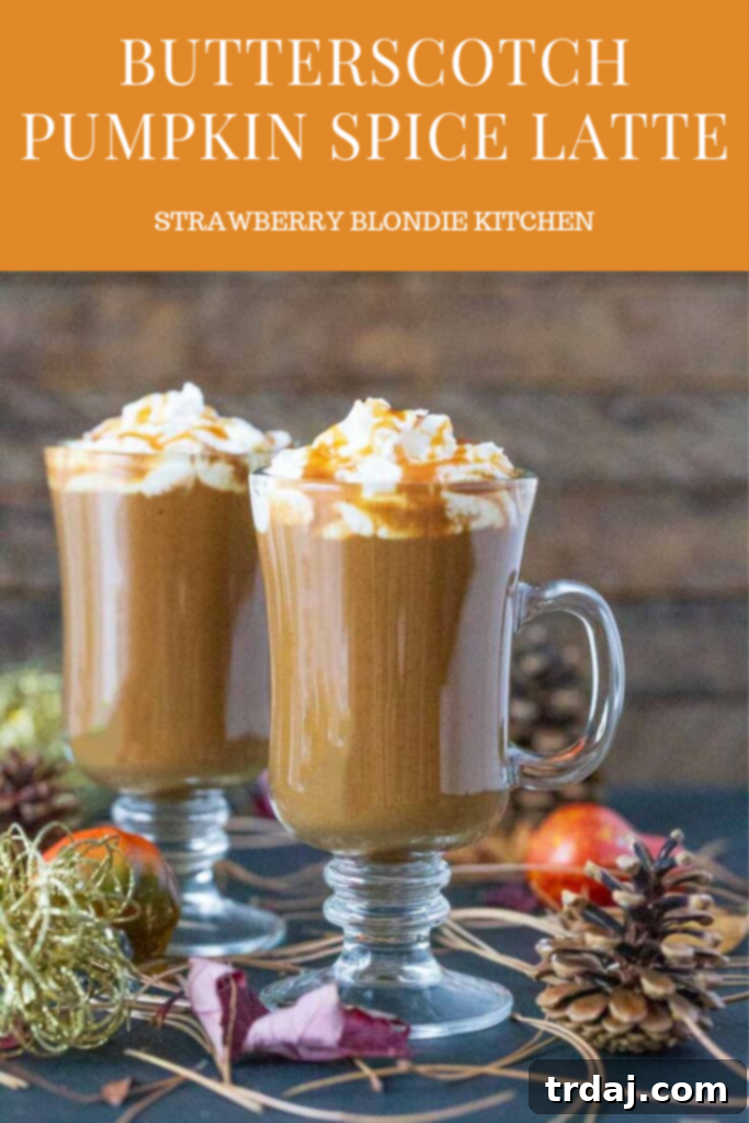 Butterscotch Pumpkin Spice Latte in a glass mug with autumn decor