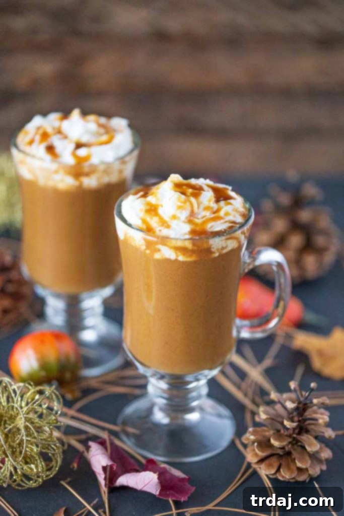 Garnished Butterscotch Pumpkin Spice Latte in a clear glass mug