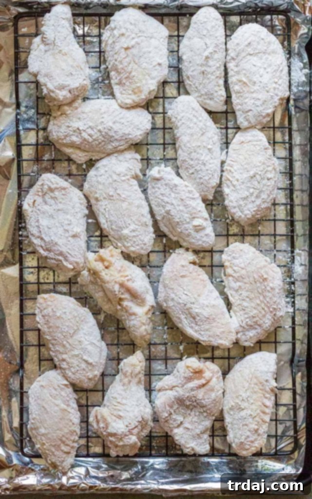 Salt and vinegar chicken wings arranged on a wire rack on a baking sheet