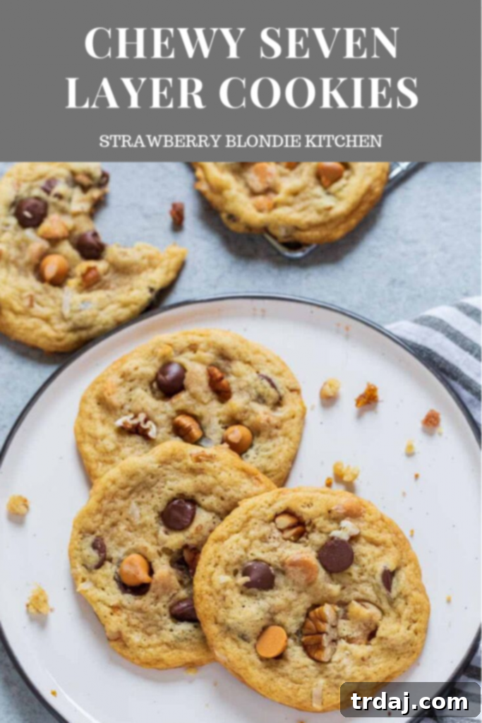 A stack of perfectly chewy Seven Layer Cookies, ready to be enjoyed.