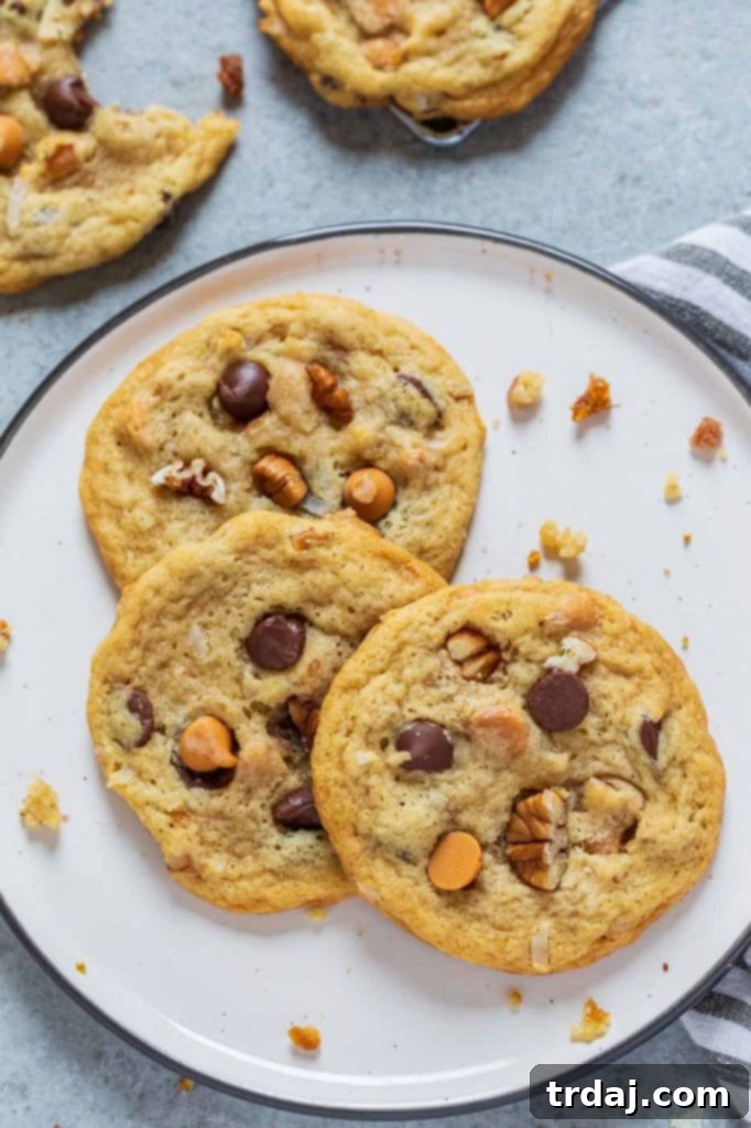 Perfectly baked Chewy Seven Layer Cookies cooling on a wire rack.