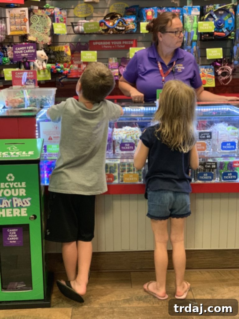 Prize wall at Chuck E. Cheese, filled with toys and gadgets for winning tickets.