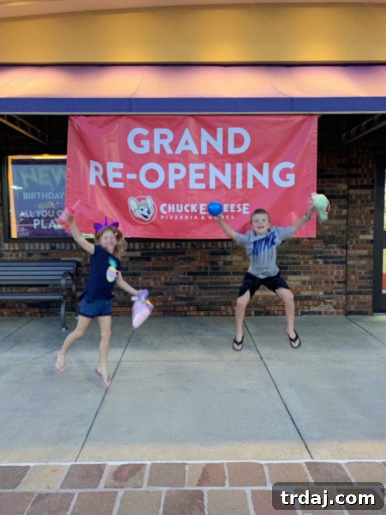 Grand Reopening Chuck E. Cheese Peoria, IL, staff and management welcoming guests.