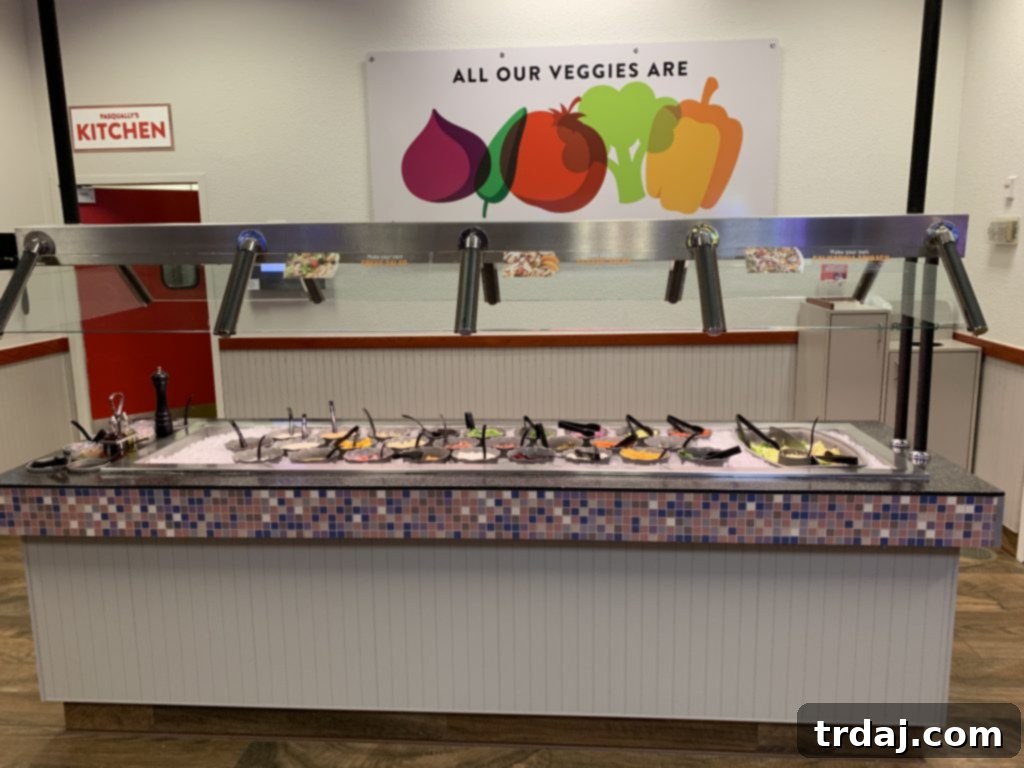 Fresh salad bar at Chuck E. Cheese, featuring a wide selection of healthy ingredients