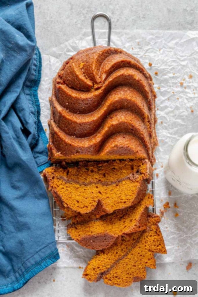 Snickerdoodle Pumpkin Bread cooling on a wire rack, showcasing its golden crust and inviting texture.