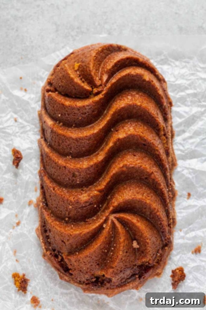Close-up of a Snickerdoodle Pumpkin Bread loaf, showing its intricate pattern from a specialty loaf pan.