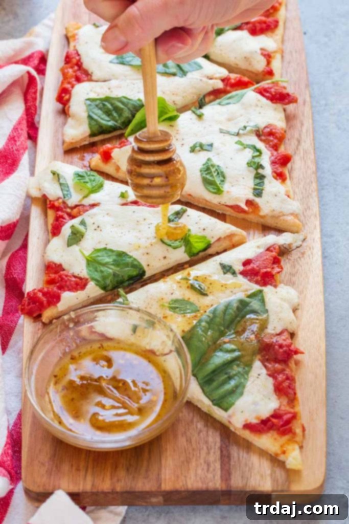 Hot honey drizzled on top of flatbread pizza