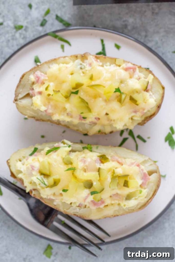 A plate of freshly baked Twice Baked Cubano Stuffed Potatoes, ready to serve