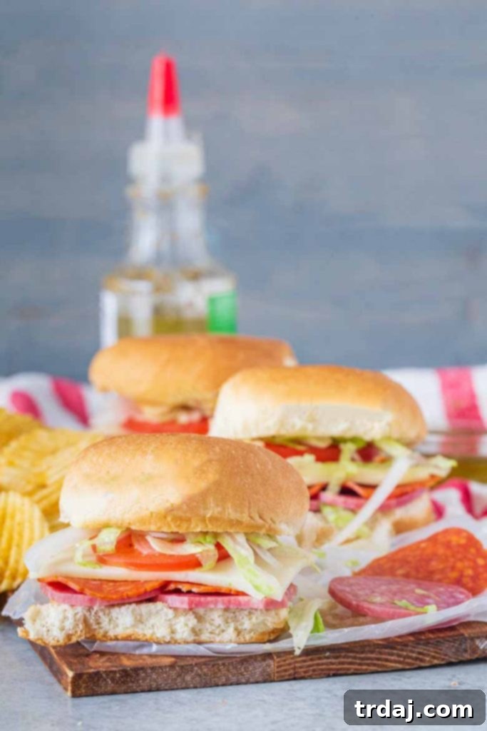 Close-up of Margherita Genoa Salami and Thick Sliced Pepperoni, neatly stacked and ready for assembly.