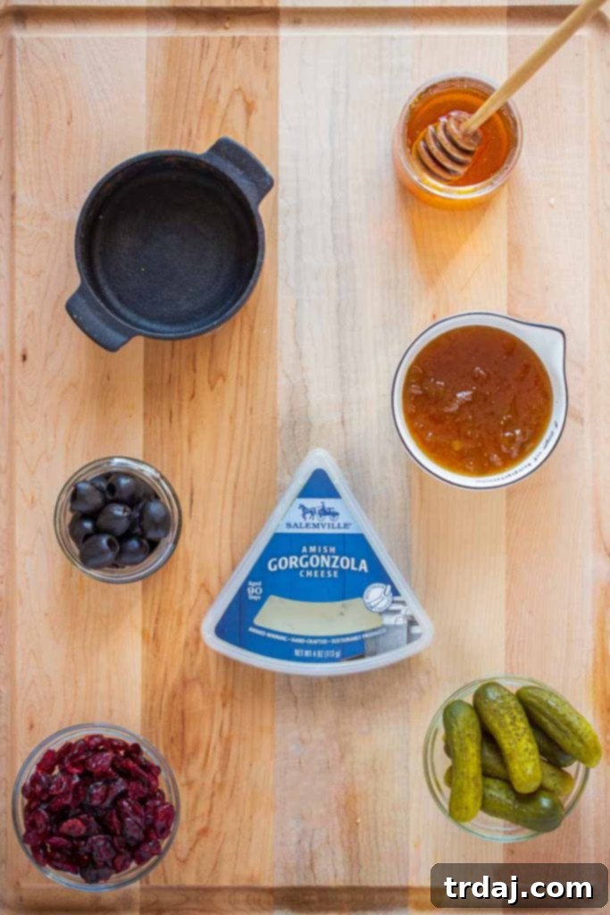 Arranging small bowls and jars on a charcuterie board before adding food