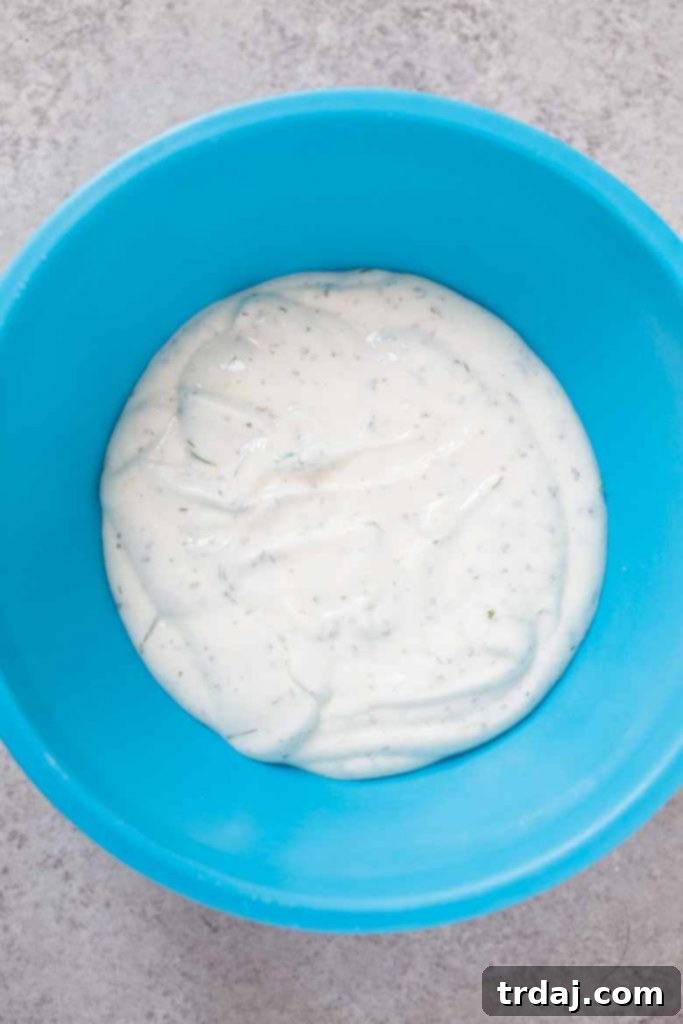 Bowl of Homemade healthy ranch dressing dipping sauce, vibrant and creamy.