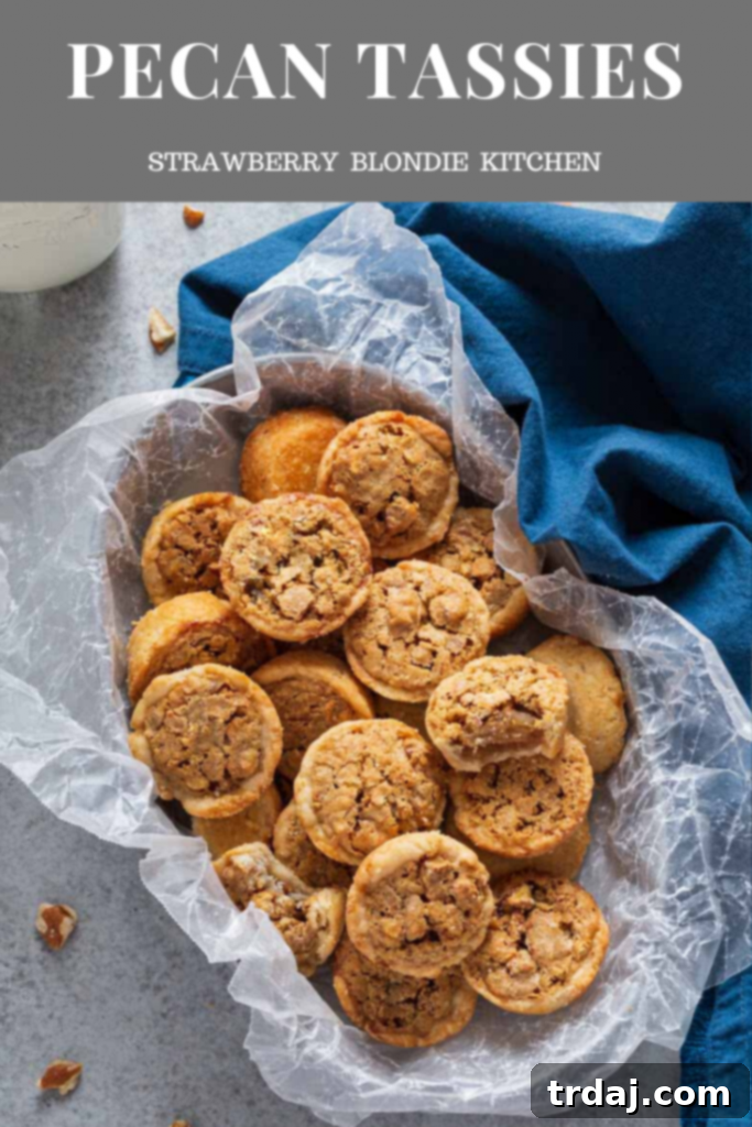 Pecan Tassies displayed on a rustic wooden board, garnished with whole pecans