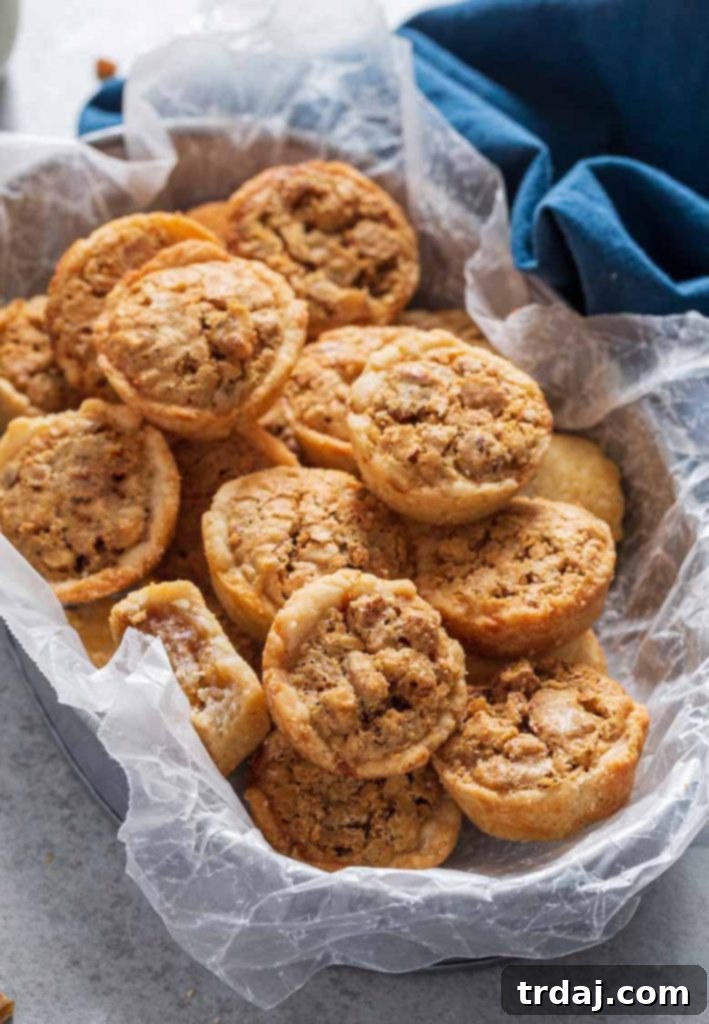 Pecan Tassies, close-up, showing flaky crust and rich pecan filling
