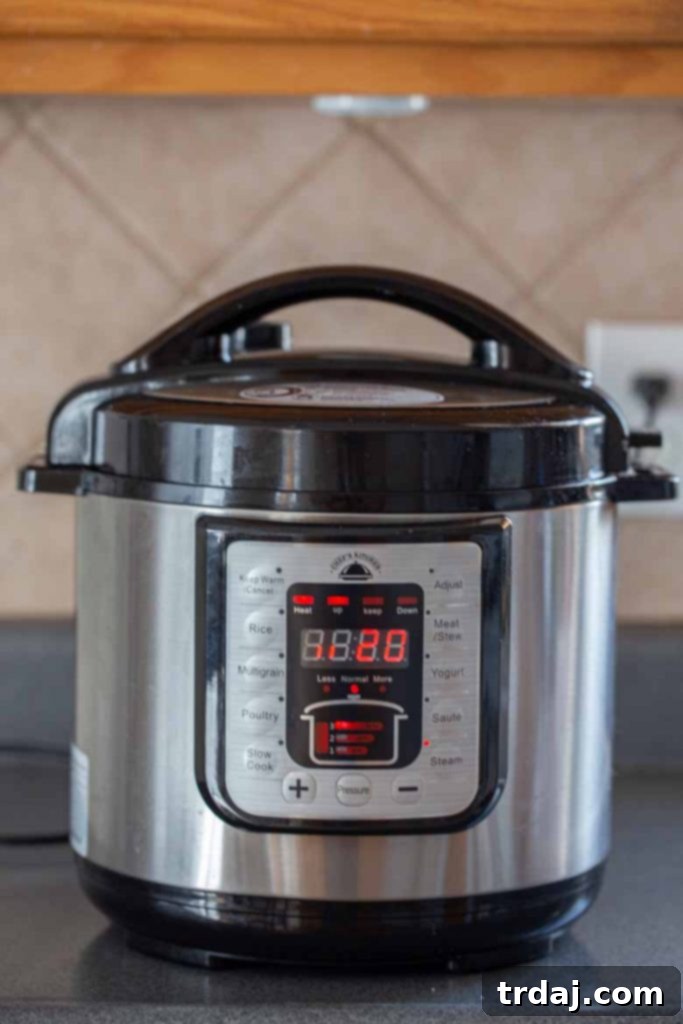 Instant Pot screen displaying 'Steam 20 minutes' for cooking potatoes, essential for perfect Instant Pot mashed potatoes.