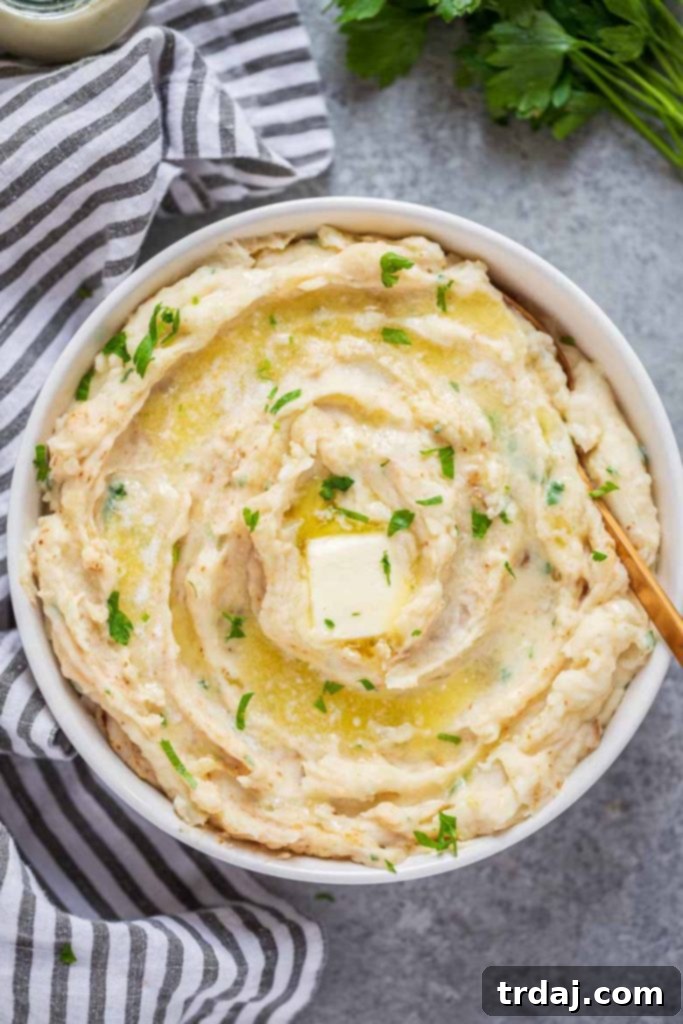 A beautifully presented bowl of creamy Instant Pot Horseradish Mashed Potatoes, garnished and ready to be enjoyed.