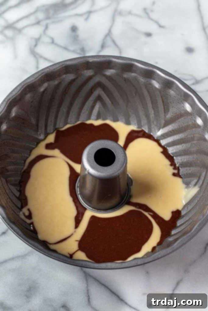 Tiramisu Swirl Delight 6 Layering vanilla and chocolate batter in a bundt pan