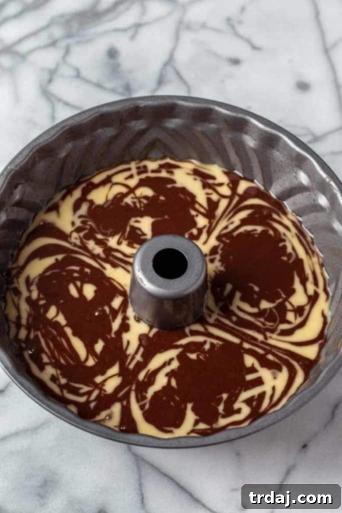 Tiramisu Swirl Delight 7 Close up of alternating batters in bundt pan