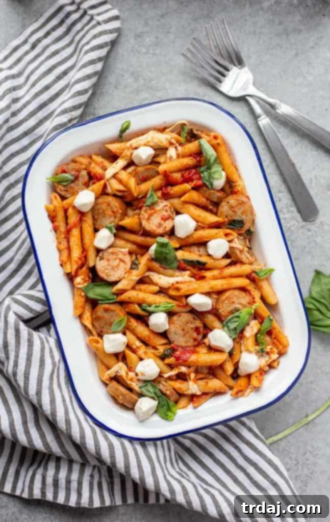 Close-up of a generous serving of One Pot Chicken Sausage Caprese Pasta