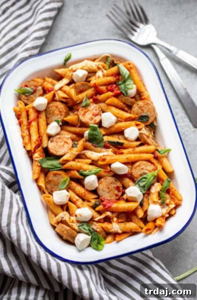 One large pan filled with the finished One Pot Chicken Sausage Caprese Pasta