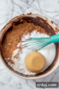 A large bowl containing all the dry ingredients for Mocha Mint Mississippi Mud Brownies, perfectly combined.