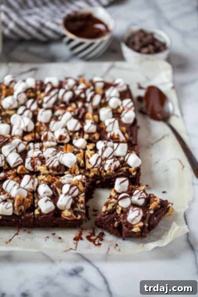 A close-up of a single Mocha Mint Mississippi Mud Brownie, highlighting its delectable layers and inviting texture.