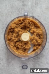 Pecans, butter, sugar, and salt finely chopped in a food processor to make no-bake pecan pie crust
