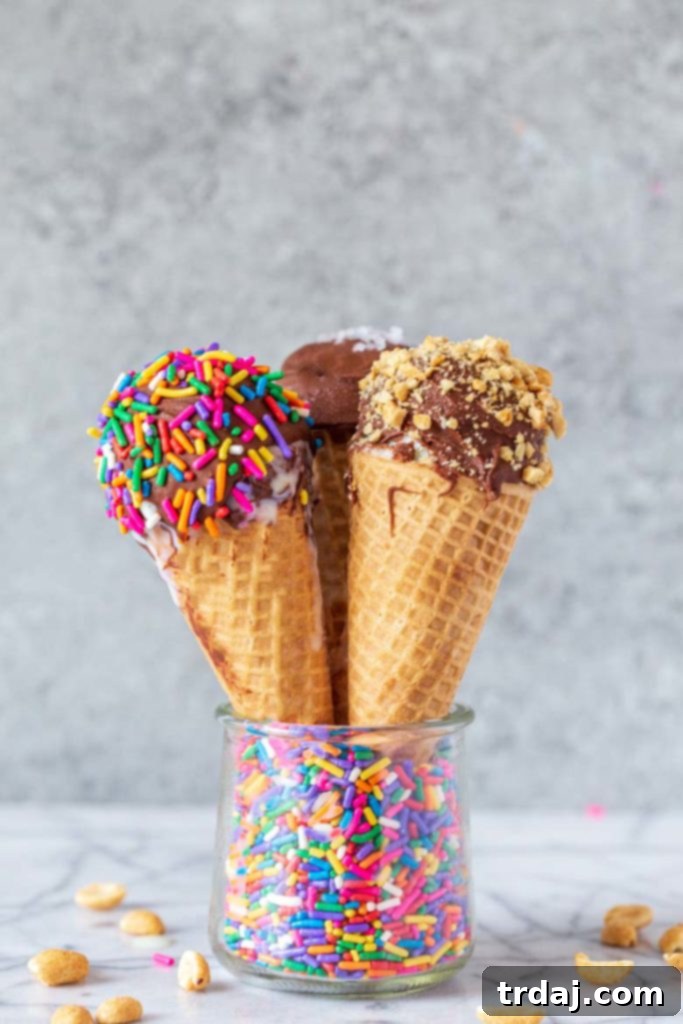 Healthier Homemade Ice Cream Drumsticks 3 ways: A nostalgic, guilt-free summer treat three homemade dipped drumstick ice cream cones styled in a glass jar with colorful sprinkles
