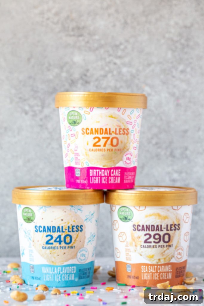 Open Nature Scandal-less light ice cream in vanilla, birthday cake, and sea salt caramel flavors Three flavors of Scandal-less light ice cream stacked styled on a concrete photography surface