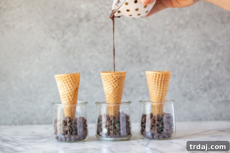 3 Healthier Homemade Ice Cream Drumstick Recipes 2 drizzling melted chocolate into the bottom of 3 sugar ice cream cones standing in glass jars filled with chocolate chips
