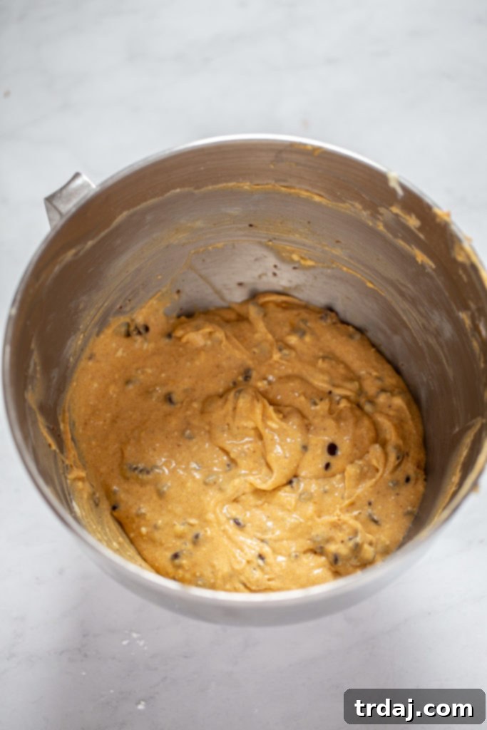 Folding in chocolate and butterscotch chips