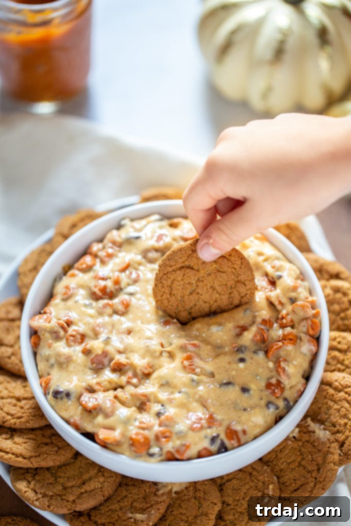 Pumpkin Spice Cheesecake Dip in a bowl with spoons