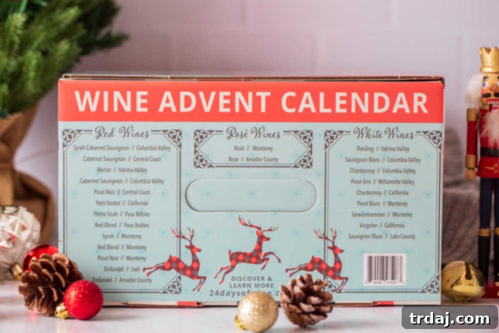 Close-up of a hand opening one of the advent calendar doors to reveal a mini wine bottle