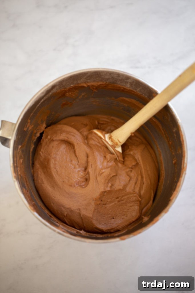 Whoopie pie batter being scooped into a special whoopie pie baking pan