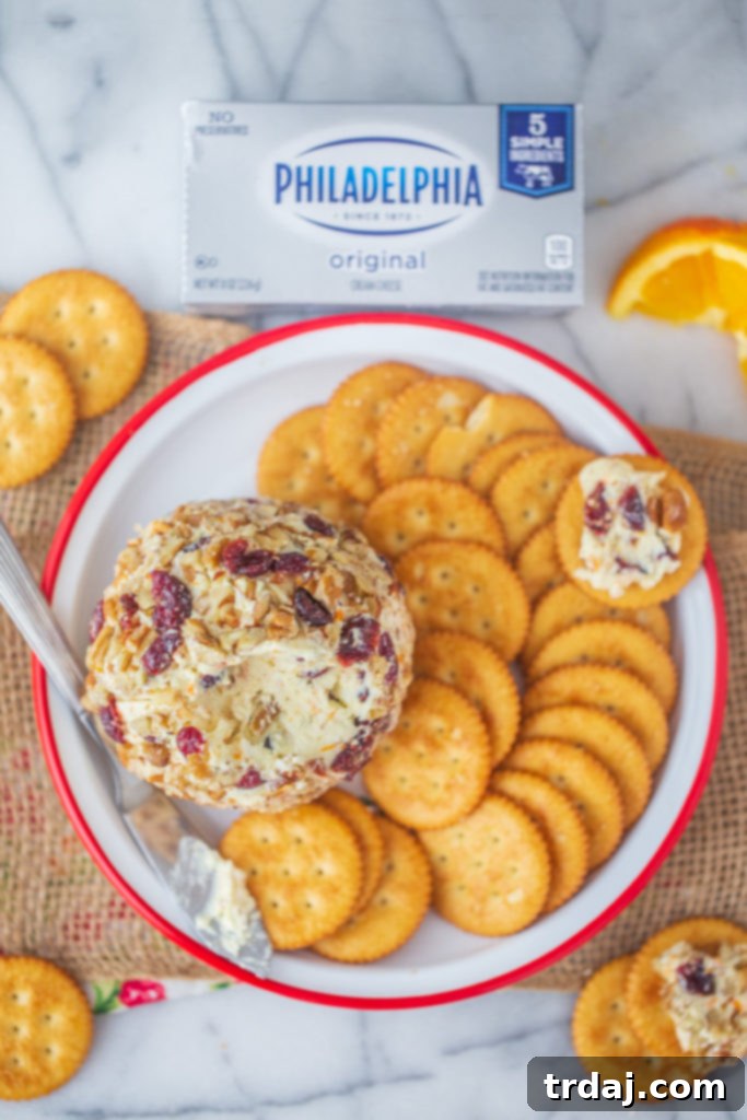 Cranberry Orange Pecan Cheeseball using Philadelphia cream cheese and can be placed on top of butter crackers