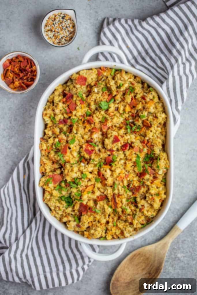 A delicious Cheesy Bacon and Everything Stuffing baked in a casserole dish, ready to be served