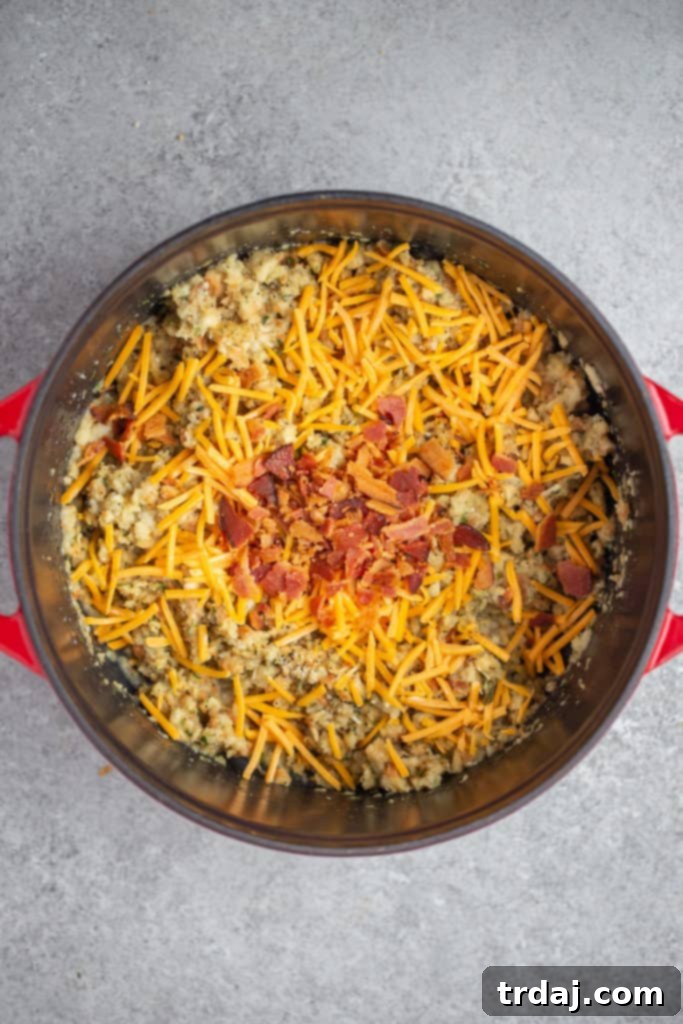 Melted cheese and crumbled bacon gently folded into the fluffy stuffing mixture