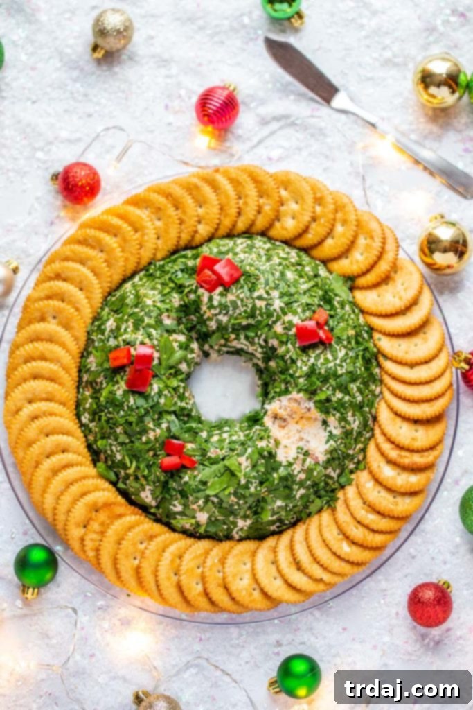 An overhead shot of the Bacon Cheddar Cheese Ball with a bite taken out, showing the creamy texture.