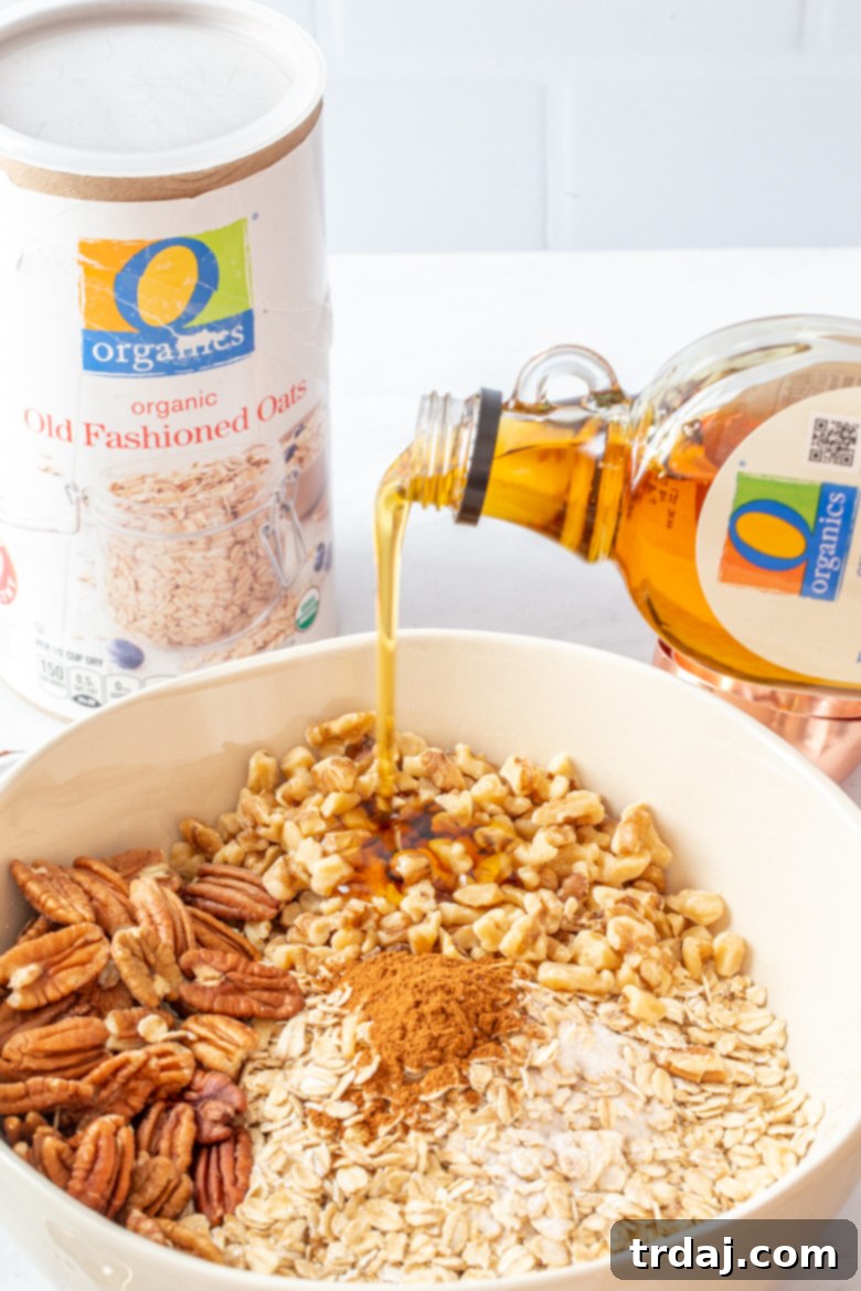 Adding walnuts, pecans, maple syrup, and olive oil to the granola mix