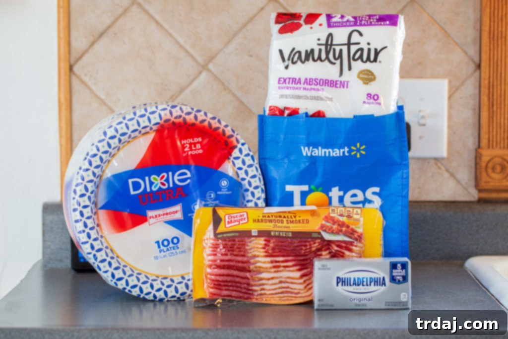 A curated selection of groceries for making Horseradish Cheesy Footballs, including cream cheese, bacon, cheddar, parmesan, horseradish, and Miracle Whip, arranged neatly on a countertop.