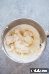 Mixing cream cheese with Miracle Whip, horseradish, garlic powder, and onion powder until smooth and blended.