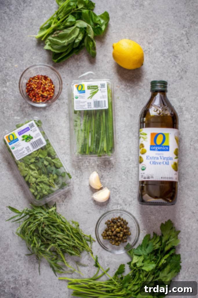 Fresh ingredients for homemade salsa verde laid out.