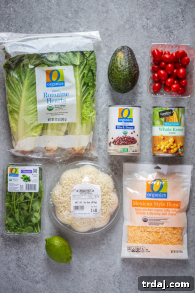 A selection of burrito bowl toppings including fresh produce.