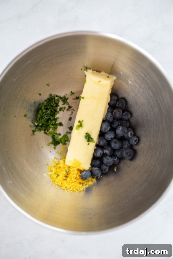 Ingredients for blueberry basil lemon butter being mixed in a stand mixer