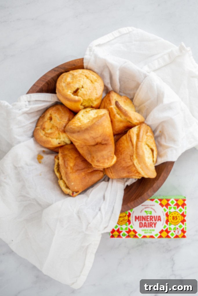 Close-up of a popover with Minerva Dairy Garlic Herb butter melting on top